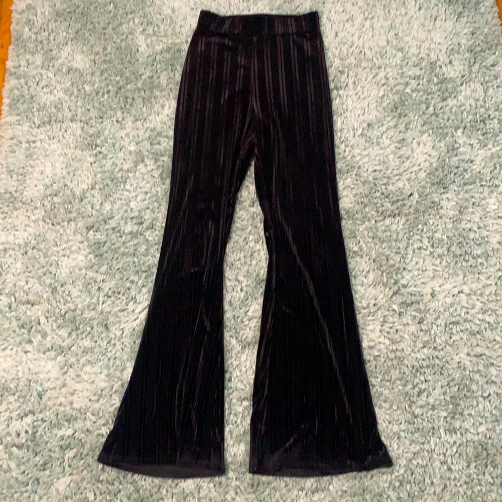Black velvet flare pants with line texturing and elastic waist band